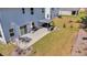 Aerial view of the backyard with a patio, seating, and well-maintained lawn in a residential neighborhood at 134 Country Oaks Ln, Wando, SC 29492