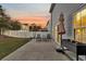 Patio area in backyard with seating and a well-kept lawn, perfect for outdoor relaxation and socializing at 134 Country Oaks Ln, Wando, SC 29492
