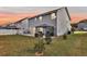 Spacious backyard with well-maintained lawn, patio, gazebo, and beautiful sunset views for relaxing outdoors at 134 Country Oaks Ln, Wando, SC 29492
