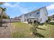 Well-maintained backyard featuring a patio, pergola, and lush green lawn for outdoor activities at 134 Country Oaks Ln, Wando, SC 29492