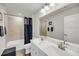 Clean bathroom features double vanity sinks, a large mirror, and a bathtub with tile at 134 Country Oaks Ln, Wando, SC 29492
