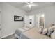 Comfortable bedroom with a neutral color palette, framed art, and bathroom access at 134 Country Oaks Ln, Wando, SC 29492