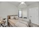 Cozy bedroom with a neutral color palette, comfortable bed, and modern ceiling fan at 134 Country Oaks Ln, Wando, SC 29492