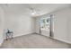 Open bedroom with a ceiling fan, a side table, and large windows showing outside views at 134 Country Oaks Ln, Wando, SC 29492