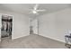 Spacious bedroom boasts neutral tones, a ceiling fan, and access to a walk-in closet at 134 Country Oaks Ln, Wando, SC 29492