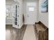 Inviting entryway with hardwood floors and a stylish bench, creating a warm welcome at 134 Country Oaks Ln, Wando, SC 29492