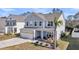Charming two-story home with a well-manicured lawn, inviting front porch, and attached two-car garage at 134 Country Oaks Ln, Wando, SC 29492