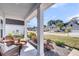 Cozy front porch with comfortable seating, offering a relaxing space to enjoy the neighborhood views at 134 Country Oaks Ln, Wando, SC 29492