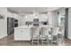 Stylish kitchen with white cabinets, stainless steel appliances, and a large island with seating at 134 Country Oaks Ln, Wando, SC 29492