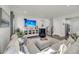 Bright living room with a large sectional sofa and entertainment center, ideal for Gathering gatherings at 134 Country Oaks Ln, Wando, SC 29492
