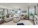 Bright living room with modern decor, comfortable seating, and plenty of natural light at 134 Country Oaks Ln, Wando, SC 29492