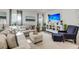 Comfortable living room with large sofa, entertainment center, and beach-themed decor at 134 Country Oaks Ln, Wando, SC 29492
