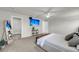 Comfortable main bedroom featuring a mounted TV, walk-in closet, and modern ceiling fan at 134 Country Oaks Ln, Wando, SC 29492