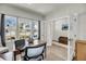 Well-lit home office with a wooden desk and large windows offering a pleasant view at 134 Country Oaks Ln, Wando, SC 29492