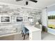 Bright home office features a decorative wall, neutral colors, and natural light at 135 Royal Cainhoy Way, Huger, SC 29450
