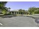 View of the clubhouse and parking lot, surrounded by lush green landscaping and mature trees at 1413 Basildon Rd, Mount Pleasant, SC 29466