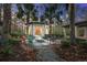 Outdoor community area with a fire pit and seating surrounded by trees and lights for a peaceful night at 1413 Basildon Rd, Mount Pleasant, SC 29466