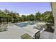 Outdoor community pool featuring plenty of seating surrounded by lush greenery and a patio area at 1413 Basildon Rd, Mount Pleasant, SC 29466