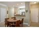 Cozy dining area featuring a wooden table and chairs next to a pass-through to the kitchen at 1413 Basildon Rd, Mount Pleasant, SC 29466