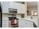 Well lit kitchen features stainless steel appliances and white cabinetry at 1413 Basildon Rd, Mount Pleasant, SC 29466