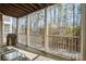 Relaxing screened-in porch with seating, overlooking a scenic wooded view at 1413 Basildon Rd, Mount Pleasant, SC 29466