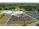 Aerial view of community recreational center with a gymnasium, tennis courts, and parking for residents at 1423 Bexley St, North Charleston, SC 29405
