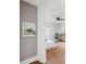 View of a bedroom through a doorway, featuring wallpaper, hardwood floors, and a ceiling fan at 1423 Bexley St, North Charleston, SC 29405