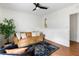 Cozy living room with wood floors, a comfortable sofa, and a decorative area rug at 1423 Bexley St, North Charleston, SC 29405