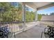 Comfortable balcony featuring two chairs with patterned pillows and a scenic view at 155 Village Ponds Dr, Summerville, SC 29483