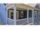 A charming covered balcony featuring stylish furniture and a relaxing outdoor space at 155 Village Ponds Dr, Summerville, SC 29483