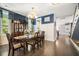Elegant dining room featuring a classic table setting, stylish decor, and hardwood floors at 155 Village Ponds Dr, Summerville, SC 29483
