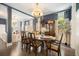 Sophisticated dining room featuring hardwood floors, stylish decor, and an adjacent living space at 155 Village Ponds Dr, Summerville, SC 29483
