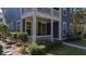 Lovely home with a covered porch, classic architectural details, and manicured landscaping at 155 Village Ponds Dr, Summerville, SC 29483