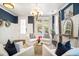 A beautifully decorated living room showcases stylish furniture, lighting, and elegant design elements at 155 Village Ponds Dr, Summerville, SC 29483