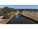 A pond with a water feature within a community setting surrounded by trees and homes at 155 Village Ponds Dr, Summerville, SC 29483