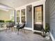 Cozy front porch with comfortable seating, stylish decor, and a welcoming entrance at 155 Village Ponds Dr, Summerville, SC 29483