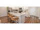 Charming kitchen featuring stainless appliances, a spacious island, and a breakfast bar at 162 Winding River Dr, Johns Island, SC 29455