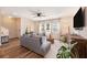 Bright living room with modern decor, hardwood floors, a ceiling fan, and lots of natural light at 162 Winding River Dr, Johns Island, SC 29455