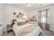 Comfortable bedroom with woven wall decor, dresser, bedside tables, and neutral accents at 162 Winding River Dr, Johns Island, SC 29455