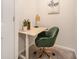 Cozy office space with plush green chair, adjustable height desk, and stylish decor at 162 Winding River Dr, Johns Island, SC 29455