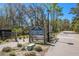 Stono River County Park entrance sign with park hours amidst a natural setting at 162 Winding River Dr, Johns Island, SC 29455