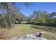 Large backyard with mature trees and wood privacy fence at 1634 Sumner Ave, North Charleston, SC 29406