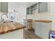 Kitchen with gray cabinets, butcher block countertops and stainless steel sink at 1634 Sumner Ave, North Charleston, SC 29406