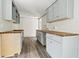 Bright kitchen featuring gray and white cabinets with butcher block countertops at 1634 Sumner Ave, North Charleston, SC 29406