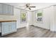 Bright kitchen with gray cabinets, butcher block countertops and luxury vinyl flooring at 1634 Sumner Ave, North Charleston, SC 29406