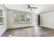 Bright living room featuring luxury vinyl flooring, a ceiling fan, and a view of the front yard at 1634 Sumner Ave, North Charleston, SC 29406