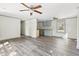 Open-concept living room featuring neutral walls, gray trim and luxury vinyl flooring at 1634 Sumner Ave, North Charleston, SC 29406