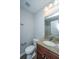 Bathroom featuring granite countertop, a mirror, vanity, and a toilet with a white door nearby at 164 Buchanan Cir, Goose Creek, SC 29445