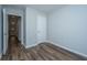 Empty bedroom with neutral paint, wood-look floors, and two closets at 164 Buchanan Cir, Goose Creek, SC 29445