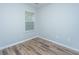 Bright bedroom with neutral walls, wood floors, and a window that provides outdoor views at 164 Buchanan Cir, Goose Creek, SC 29445